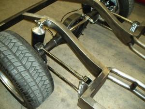 Progressive Automotive 1937-41 Willys chassis with rear frame rails narrowed more than 2”/4-Link and Ride Tech HQ ShockWaves